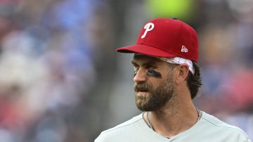 Philadelphia Phillies first baseman Bryce Harper looks on during the seventh inning of a baseball game against the Washington Nationals in Washington, Sunday, March 30, 2025. (AP Photo/Terrance Williams)