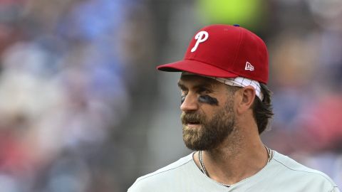 Philadelphia Phillies first baseman Bryce Harper looks on during the seventh inning of a baseball game against the Washington Nationals in Washington, Sunday, March 30, 2025. (AP Photo/Terrance Williams)