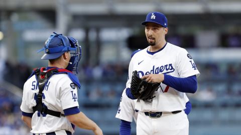 Los Angeles Dodgers' Blake Snell, right, gets a visit from catcher Will Smith during the second inning of a baseball game against the Atlanta Braves Wednesday, April 2, 2025, in Los Angeles. (AP Photo/Kevork Djansezian)
