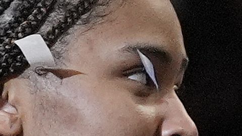 UConn guard Paige Bueckers, center, and guard Paige Bueckers react on stage during the trophy ceremony after defeating South Carolina in the national championship game at the Final Four of the women's NCAA college basketball tournament, Sunday, April 6, 2025, in Tampa, Fla. (AP Photo/John Raoux)