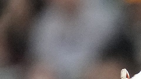 San Diego Padres' Luis Arraez lies on the ground after a collision with with Houston Astros second baseman Mauricio Dubon, left, as Padres first base coach David Macias (46) along with an Astros' trainer check on him at first base during the first inning of a baseball game Sunday, April 20, 2025, in Houston. (AP Photo/Karen Warren)