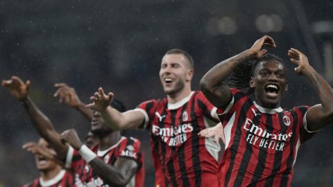 AC Milan players celebrate after the Italian Cup semifinal second leg soccer match between Inter Milan and AC Milan at the San Siro stadium in Milan, Italy, Wednesday, April 23, 2025. (AP Photo/Luca Bruno)