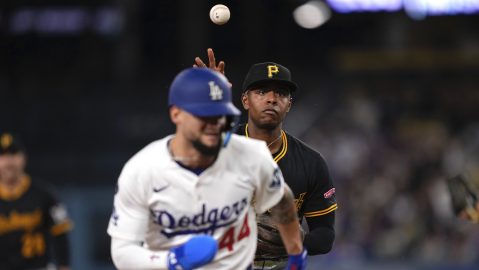 Los Angeles Dodgers' Andy Pages is caught between second and third as Pittsburgh Pirates third baseman Ke'Bryan Hayes throws to third during the third inning of a baseball game Friday, April 25, 2025, in Los Angeles. Pages was thrown out at third on the play. (AP Photo/Mark J. Terrill)
