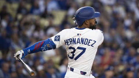 Los Angeles Dodgers' Teoscar Hernández hits an RBI double during a baseball game against the Miami Marlins in Los Angeles, Tuesday, April 29, 2025. (AP Photo/Kyusung Gong)
