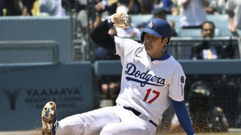 Los Angeles Dodgers' Shohei Ohtani (17) slides home to sore a run against the Miami Marlins during the third inning of a baseball game Wednesday, April 30, 2025, in Los Angeles. (AP Photo/Wally Skalij)
