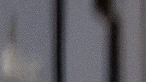 A woman shields her eyes from the sun as she walks in downtown Los Angeles during a heatwave Friday, Sept. 6, 2024. (AP Photo/Etienne Laurent)