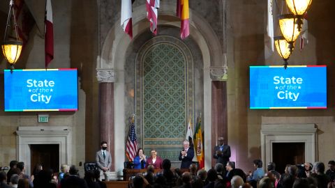 Los Angeles Mayor Karen Bass, at podium, is welcomed to deliver her first State of the City address from City Hall in Los Angeles, Monday, April 17, 2023. (AP Photo/Damian Dovarganes)