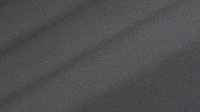 FILE - A woman looks at a hand held device on a train in New Jersey on May 18, 2021. (AP Photo/Jenny Kane, File)