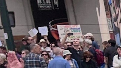 People gather to protest President Donald Trump's policies on Saturday, April 19, 2025 in New York. (AP Photo/Joseph Frederick)