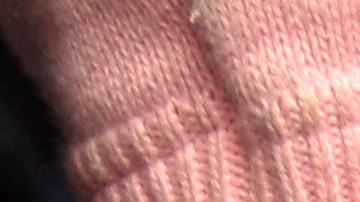 An unidentified female Colombian suspect in handcuffs is presented to the press after her Monday arrest in connection with seized cocaine at a police base in Lima, Peru, Wednesday Aug. 17, 2011. According to police, about one ton of cocaine was seized during two operations, on Aug. 11 and Aug. 15 in Lima and in the northern province of Paita, and four Colombians were arrested. (AP Photo/Martin Mejia)