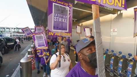 Workers with SEIU Local 721 - Southern California Public Service Workers join a picket line at the Los Angeles International Airport on Tuesday, Aug. 8, 2023. Thousands of Los Angeles city employees, including sanitation workers, engineers and traffic officers, walked off the job for a 24-hour strike alleging unfair labor practices. (AP Photo/Damian Dovarganes)