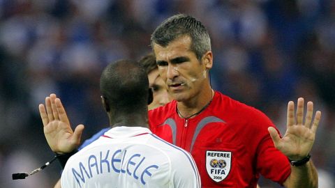 Referee Horacio Elizondo, of Argentina, talks to France Claude Makelele during the final of the soccer World Cup between Italy and France in the Olympic Stadium in Berlin, Sunday, July 9, 2006. (AP Photo/Christophe Ena) ** MOBILE/PDA USAGE OUT **