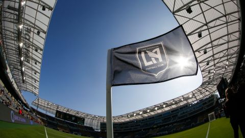 FILE - In this April 29, 2018 file photo taken with a fisheye lens, a flag flies at the Banc of California Stadium prior to an MLS soccer game between Los Angeles FC and the Seattle Sounders in Los Angeles. Los Angeles FC will seek a new name for its 2-year-old Banc of California Stadium after a restructuring of the bank's partnership with the Major League Soccer club. LAFC announced Tuesday, May 26, 2020 that Banc of California will eventually give up its naming rights to the sleek new stadium just south of downtown Los Angeles. (AP Photo/Ringo H.W. Chiu, file)