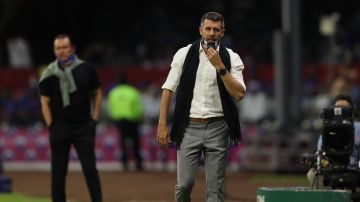 Pachuca's coach Paulo Pezzolano walks on the sidelines during a Mexican soccer league semifinal second leg match at Azteca stadium in Mexico City, Saturday, May 22, 2021. (AP Photo/Fernando Llano)