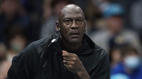 Michael Jordan looks on during the first half of an NBA basketball game between the Charlotte Hornets and the New York Knicks in Charlotte, N.C., Friday, Nov. 12, 2021. (AP Photo/Jacob Kupferman)