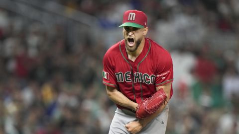 Mexico pitcher Patrick Sandoval reacts after striking out Japan's Munetaka Murakami to end the fourth inning of a World Baseball Classic game, Monday, March 20, 2023, in Miami. (AP Photo/Wilfredo Lee)