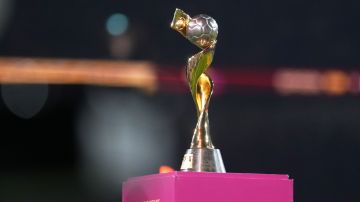 FILE - The tournament trophy is displayed on the pitch before the Women's World Cup soccer final between Spain and England at Stadium Australia in Sydney, Australia, on Aug. 20, 2023. Brazil's bid for the 2027 Women's World Cup was ranked higher than the bid submitted by Germany, the Netherlands and Belgium in an evaluation report released by FIFA on Tuesday, May 7, 2024. (AP Photo/Abbie Parr, File)