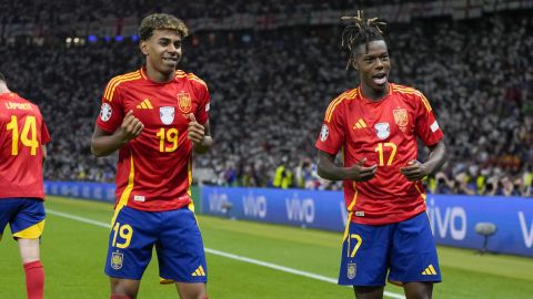 Spain's Nico Williams, right, celebrates with his teammate Lamine Yamal after scoring his side's opening goal during the final match between Spain and England at the Euro 2024 soccer tournament in Berlin, Germany, Sunday, July 14, 2024. (AP Photo/Matthias Schrader)