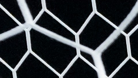 A shot by Egypt's Hossam Abdelmaguid, left, enters the net of Paraguay goalkeeper Gatito Fernandez for a goal during a penalty kick shootout of a men's quarterfinal soccer match between Egypt and Paraguay at the 2024 Summer Olympics, Friday, Aug. 2, 2024, at Marseille Stadium in Marseille, France. Egypt won 5-4 (1-1) in penalty kicks. (AP Photo/Julio Cortez)