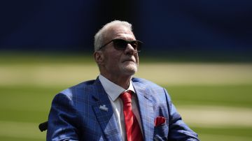 Indianapolis Colts owner Jim Irsay is seen on the field as former Colts player Dwight Freeney is honored during the half time of an NFL football game between the Indianapolis Colts and the Houston Texans, Sunday, Sept. 8, 2024, in Indianapolis. (AP Photo/Darron Cummings)