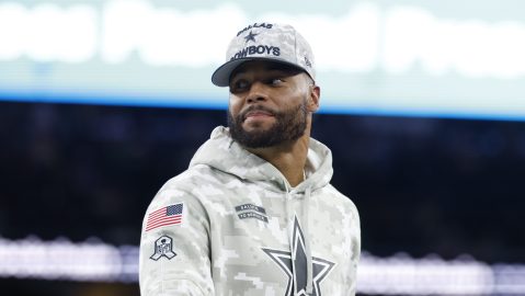 A Salute to Service emblem on sweatshirt and cap worn by Dallas Cowboys quarterback Dak Prescott (4) after an NFL football game against the Philadelphia Eagles on Sunday, Nov. 10, 2024, in Arlington, Texas. (AP Photo/Matt Patterson)