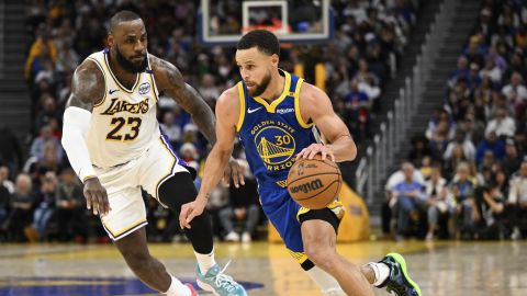 Golden State Warriors guard Stephen Curry (30) dribbles against Los Angeles Lakers forward LeBron James (23) during the second half of an NBA basketball game Wednesday, Dec. 25, 2024, in San Francisco. (AP Photo/Eakin Howard)