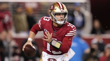 San Francisco 49ers quarterback Brock Purdy (13) rolls out during the first half of an NFL football game against the Detroit Lions, Monday, Dec. 30, 2024, in Santa Clara, Calif. (AP Photo/Godofredo A. Vásquez)