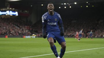 PSG's Ousmane Dembele jcelebrtaes after scoring during the Champions League round of 16 second leg soccer match between Liverpool and Paris Saint-Germain at Anfield in Liverpool, England, Tuesday, March 11, 2025. (AP Photo/Jon Super)