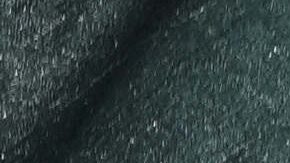 Signs that read in Spanish "Justice for God," cover a wall where police stand guard outside the court where the medical team that treated the late soccer star Diego Maradona is on trial facing charges of homicide by negligence, in San Isidro, on the outskirts of Buenos Aires, Argentina, Thursday, April 3, 2025. (AP Photo/Rodrigo Abd)