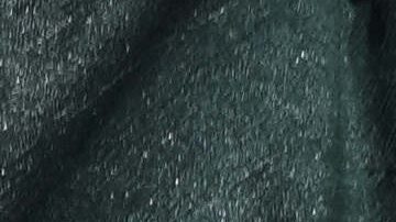 Signs that read in Spanish "Justice for God," cover a wall where police stand guard outside the court where the medical team that treated the late soccer star Diego Maradona is on trial facing charges of homicide by negligence, in San Isidro, on the outskirts of Buenos Aires, Argentina, Thursday, April 3, 2025. (AP Photo/Rodrigo Abd)