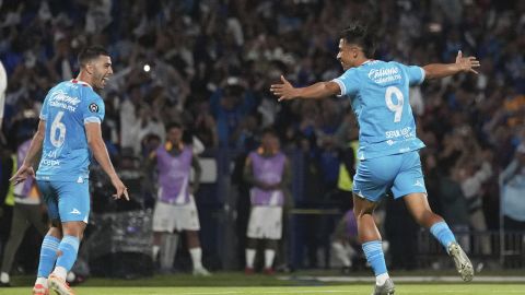 Angel Sepulveda of Mexico's Cruz Azul, right, celebrates scoring his side's opening goal from the penalty spot alongside Erik Lira against Mexico's Tigres during a CONCACAF Champions Cup second leg semifinal soccer match in Mexico City, Thursday, May 1, 2025. (AP Photo/Eduardo Verdugo)