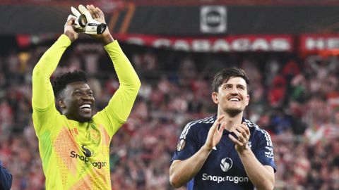 Manchester United's goalkeeper Andre Onana and Manchester United's Harry Maguire celebrate their victory at the Europa League semifinal first leg soccer match between Athletic Bilbao and Manchester United at the San Mames stadium in Bilbao, Spain, Thursday, May 1, 2025. (AP Photo/Miguel Oses)