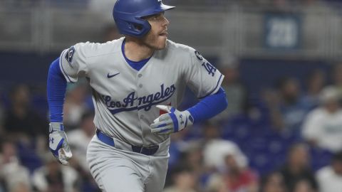 Los Angeles Dodgers' Freddie Freeman (5) watches his home run go over the center field wall during the sixth inning of a baseball game against the Miami Marlins, Tuesday, May 6, 2025, in Miami. (AP Photo/Marta Lavandier)