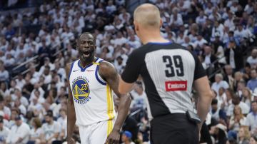 Golden State Warriors forward Draymond Green (23) reacts toward referee Tyler Ford during the second half of Game 2 of an NBA basketball second-round playoff series against the Minnesota Timberwolves, Thursday, May 8, 2025, in Minneapolis. (AP Photo/Abbie Parr)