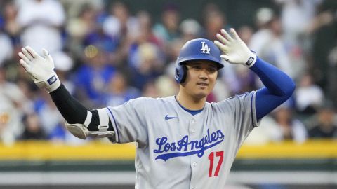 Los Angeles Dodgers' Shohei Ohtani gestures after hitting a double against the Arizona Diamondbacks during the first inning of a baseball game Friday, May 9, 2025, in Phoenix. (AP Photo/Darryl Webb)