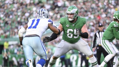 FILE - Philadelphia Eagles offensive tackle Lane Johnson (65) in action against Dallas Cowboys linebacker Micah Parsons (11) during the second half of an NFL football game, Dec. 29, 2024, in Philadelphia. (AP Photo/Terrance Williams, file)