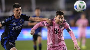 San Jose Earthquakes defender Daniel Munie, left, and Inter Miami midfielder Lionel Messi race after the ball during the first half of an MLS soccer match Wednesday, May 14, 2025, in San Jose, Calif. (AP Photo/Godofredo A. Vásquez)