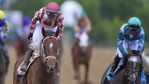 Umberto Rispoli, left, atop Journalism, reacts after edging out Luis Saez, atop Gosger, to win the the 150th running of the Preakness Stakes horse race Saturday, May 17, 2025, at Pimlico Race Course in Baltimore. (AP Photo/Nick Wass)