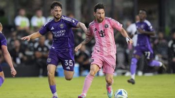 Inter Miami forward Lionel Messi (10) vies for the ball with Orlando City midfielder Joran Gerbet (35) during the first half of an MLS soccer match, Sunday, May 18, 2025, in Fort Lauderdale, Fla. (AP Photo/Rebecca Blackwell)