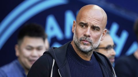 Manchester City's head coach Pep Guardiola waits for the start of the English Premier League soccer match between Manchester City and Bournemouth at the Etihad stadium in Manchester, England, Tuesday, May 20, 2025. (AP Photo/Dave Thompson)