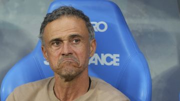 PSG's head coach Luis Enrique sits on the bench prior to the French Cup soccer final between Paris Saint-Germain and Reims at the Stade de France stadium in Saint-Denis, outside Paris, Saturday, May 24, 2025. (AP Photo/Aurelien Morissard)