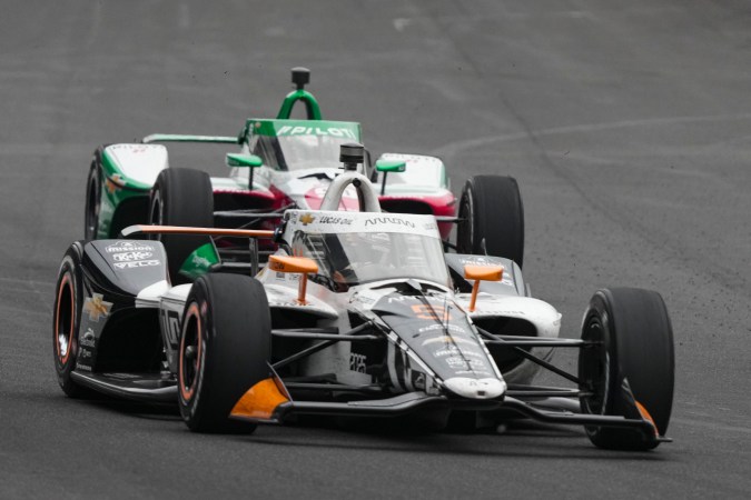 Pato O'Ward, of Mexico, heads into the first turn during of the Indianapolis 500 auto race at Indianapolis Motor Speedway in Indianapolis, Sunday, May 25, 2025. (AP Photo/AJ Mast)