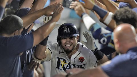 Tampa Bay Rays' Jonathan Aranda celebrates in the dugout after his three-run home run off Minnesota Twins pitcher Brock Stewart during the sixth inning of a baseball game Monday, May 26, 2025, in Tampa, Fla. (AP Photo/Chris O'Meara)