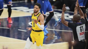 Indiana Pacers guard Tyrese Haliburton (0) celebrates a three point basket during the first half of Game 4 of the Eastern Conference finals of the NBA basketball playoffs against the New York Knicks in Indianapolis, Tuesday, May 27, 2025. (AP Photo/Michael Conroy)