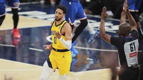 Indiana Pacers guard Tyrese Haliburton (0) celebrates a three point basket during the first half of Game 4 of the Eastern Conference finals of the NBA basketball playoffs against the New York Knicks in Indianapolis, Tuesday, May 27, 2025. (AP Photo/Michael Conroy)