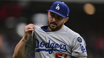 Los Angeles Dodgers relief pitcher Alex Vesia walks to the dugout after the eighth inning of a baseball game against the Cleveland Guardians, Wednesday, May 28, 2025, in Cleveland. (AP Photo/David Dermer)