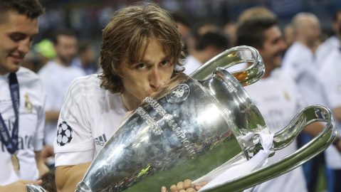 Real Madrid's Luka Modric kisses the trophy after the Champions League final soccer match between Real Madrid and Atletico Madrid at the San Siro stadium in Milan, Italy, Saturday, May 28, 2016. Real Madrid won 5-4 on penalties after the match ended 1-1 after extra time. (AP Photo/Luca Bruno)
