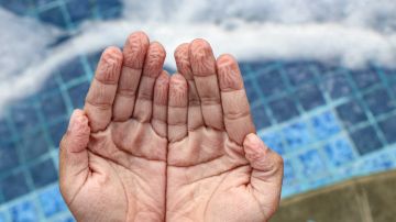 Closeup,Photo,Of,Wrinkled,Hands,And,Feet,After,Playing,In
