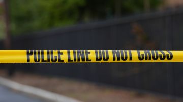 Police tape cordons off an area outside Pennsylvania governor's official residence in Harrisburg, Pa., Monday, April 14, 2025. (AP Photo/Matt Rourke)