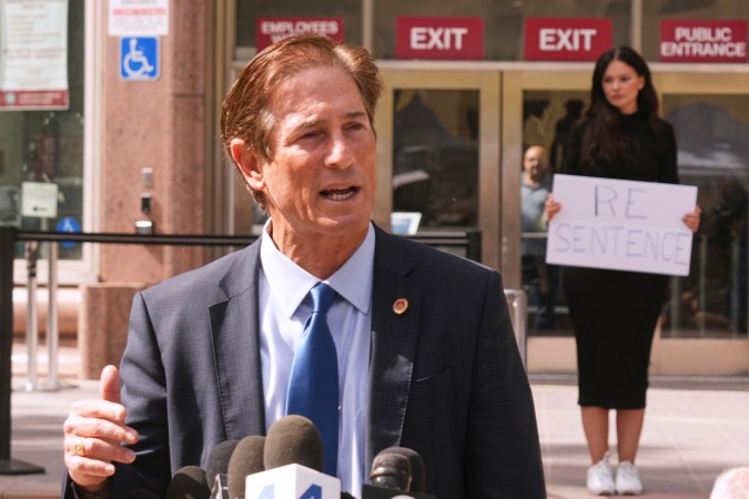 Los Angeles County District Attorney Nathan Hochman speaks to the media during a hearing in the case of Erik and Lyle Menendez Tuesday, May 13, 2025, in Los Angeles. (AP Photo/Damian Dovarganes)